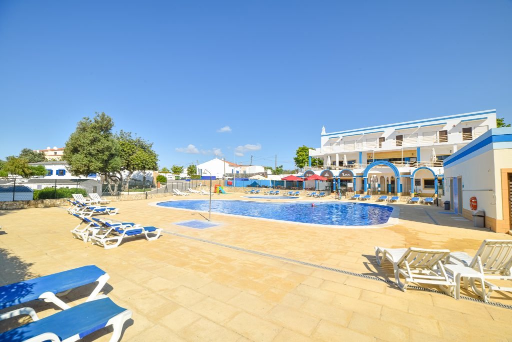 Camping pitches shaded by trees at Camping Alvor